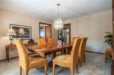 Formal dining room can accommodate all of those fa