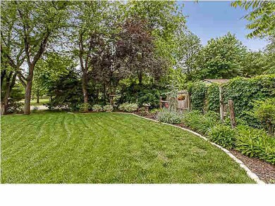 North side fencing with lovely perennial bed. Walk