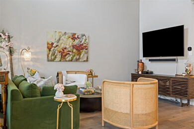 Living room with hardwood / wood-style flooring
