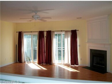 Den/Family/Great Room. Beautiful floors throughout the downstairs!  Corner fireplace and patio access with breath-taking pond views!  This flexible space allows plenty of options!