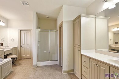 Separate vanities, separate walk-in His & Her clos