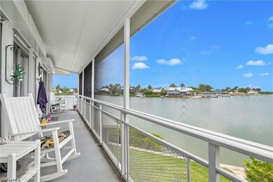 Sunroom with a water view