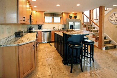 Kitchen with high quality custom granite and trave