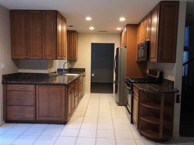 Kitchen with granite counter tops and stainless st