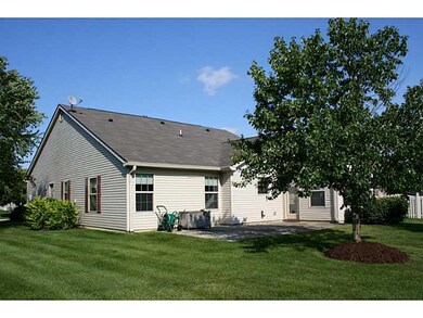 Exterior Back. Lovely sun room opens to spacious patio.