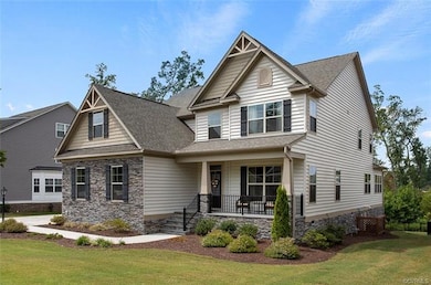 Exterior front showing stone detail and landscapin