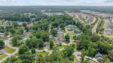 Aerial view of property's location featuring nearby suburban area