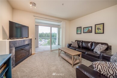 Living room includes electric fireplace