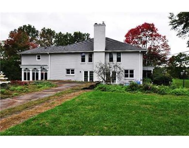Exterior Back. Plenty of lawn surrounds the rear p