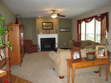FAMILY ROOM OPEN TO KITCHEN GASS FIREPACE.