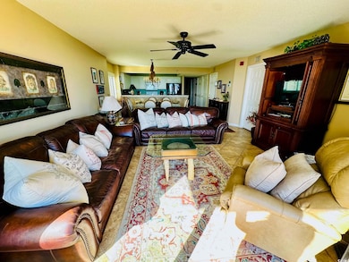 Tiled living room with a textured ceiling and ceil