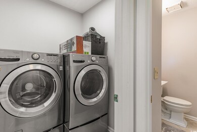 Clothes washing area with washing machine and drye