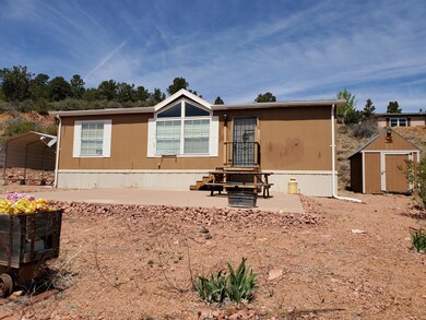 Front w/ Large Concrete Patio, Shed