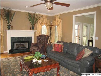 Large den with gas fireplace and door opening onto