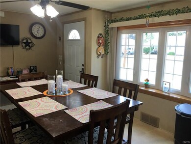 The dining room is open to the kitchen and has new