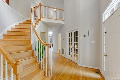 Enter the 2-story Foyer with Grand Curved Staircas