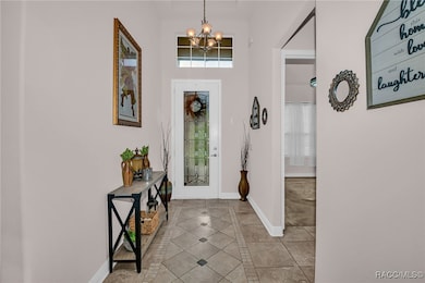 Entry with inlayed tiles - guest bed and bath is t