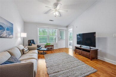 The living room has plenty of natural light.