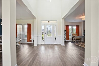 2-story Foyer flanked by formal dining and study