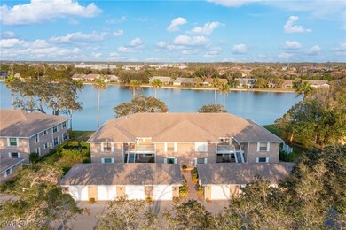 Aerial view of buidling with view of shingled roof