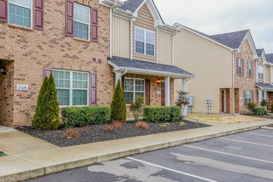 Townhome offers to assigned parking spaces out front of home.