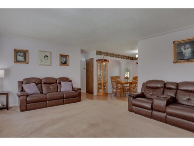 View of living room from the door, bedrooms are of