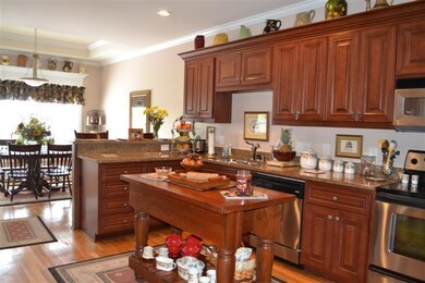 28X12 GOURMET KITCHEN W/HARDWOOD, CUSTOM CABINETS & GRANITE COUNTERTOPS.