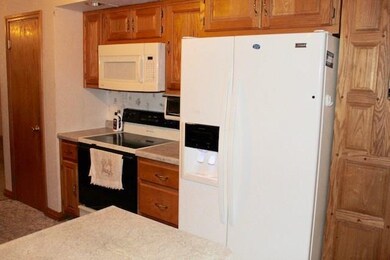 More of the kitchen; with pantry storage.  Applian