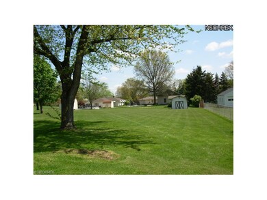 Back yard with small utility shed in southeast cor