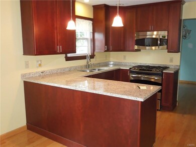 New kitchen with granite counters, stainless appli
