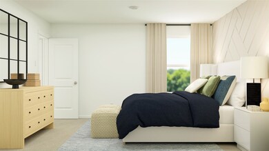 Bedroom featuring light colored carpet