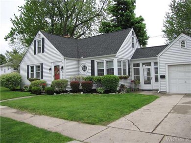 Exterior Front. Lovely landscaping enhances the ma