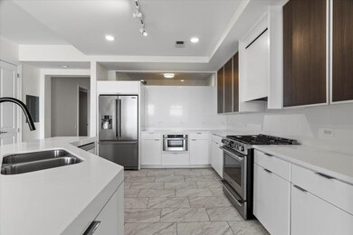 Kitchen with visible vents, a sink, light countert