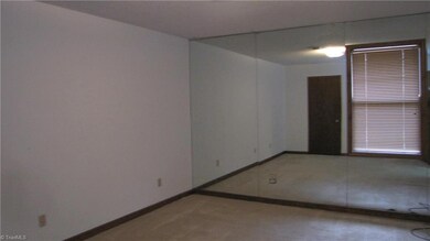 Master bedroom with mirrored wall