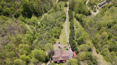 Aerial view of house and bulk of the property.
