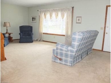 Spacious formal living room with picture window.
