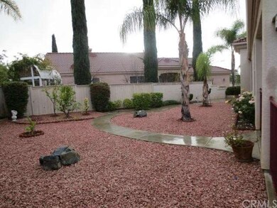 Close up of front side yard featuring low water an