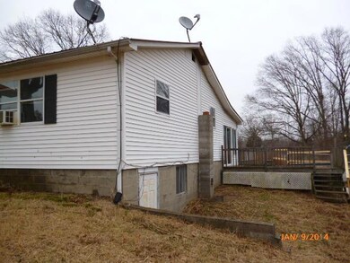 Right side, entrance to basement