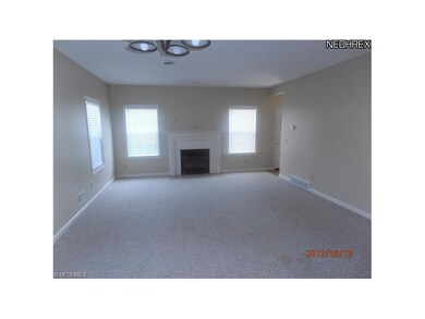 Spacious living/dining room with gas fireplace.
