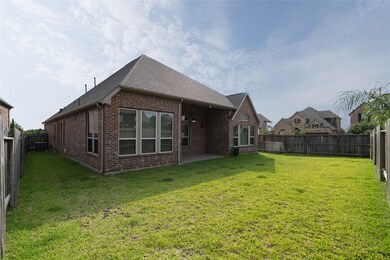 Nice size backyard with lots of windows and a cove