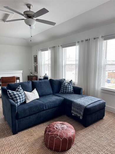 Living area featuring carpet floors and ceiling f