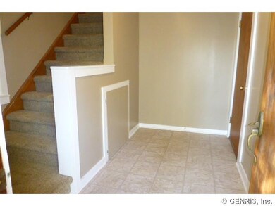 Foyer. Door to the right is main 2 bedroom. Go ups