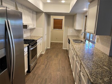 Kitchen featuring dark hardwood / wood-style floor