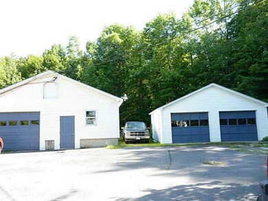 Exterior Front. commercial bldg & garage