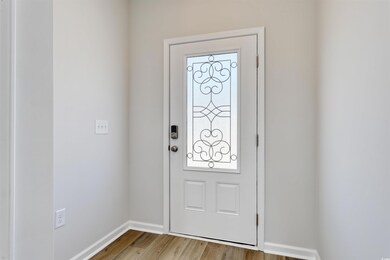 Entrance foyer featuring light hardwood / wood-sty