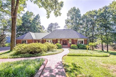 The beautiful brick walkway leads you to two entrances in the front of the home.  One is the main entrance, the other (to the left) leads directly to the kitchen.