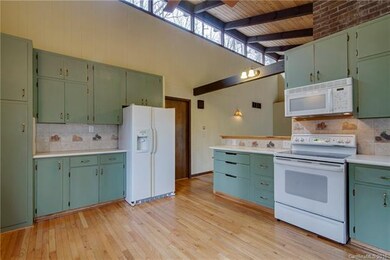 Custom cabinetry and tile in kitchen.