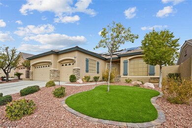 View of front of home featuring driveway, solar pa