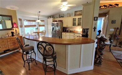 custom top on bar looking into eat in kitchen with