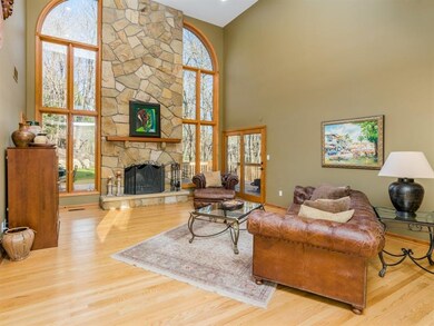 The warm hardwood floors, the stone fireplace and 